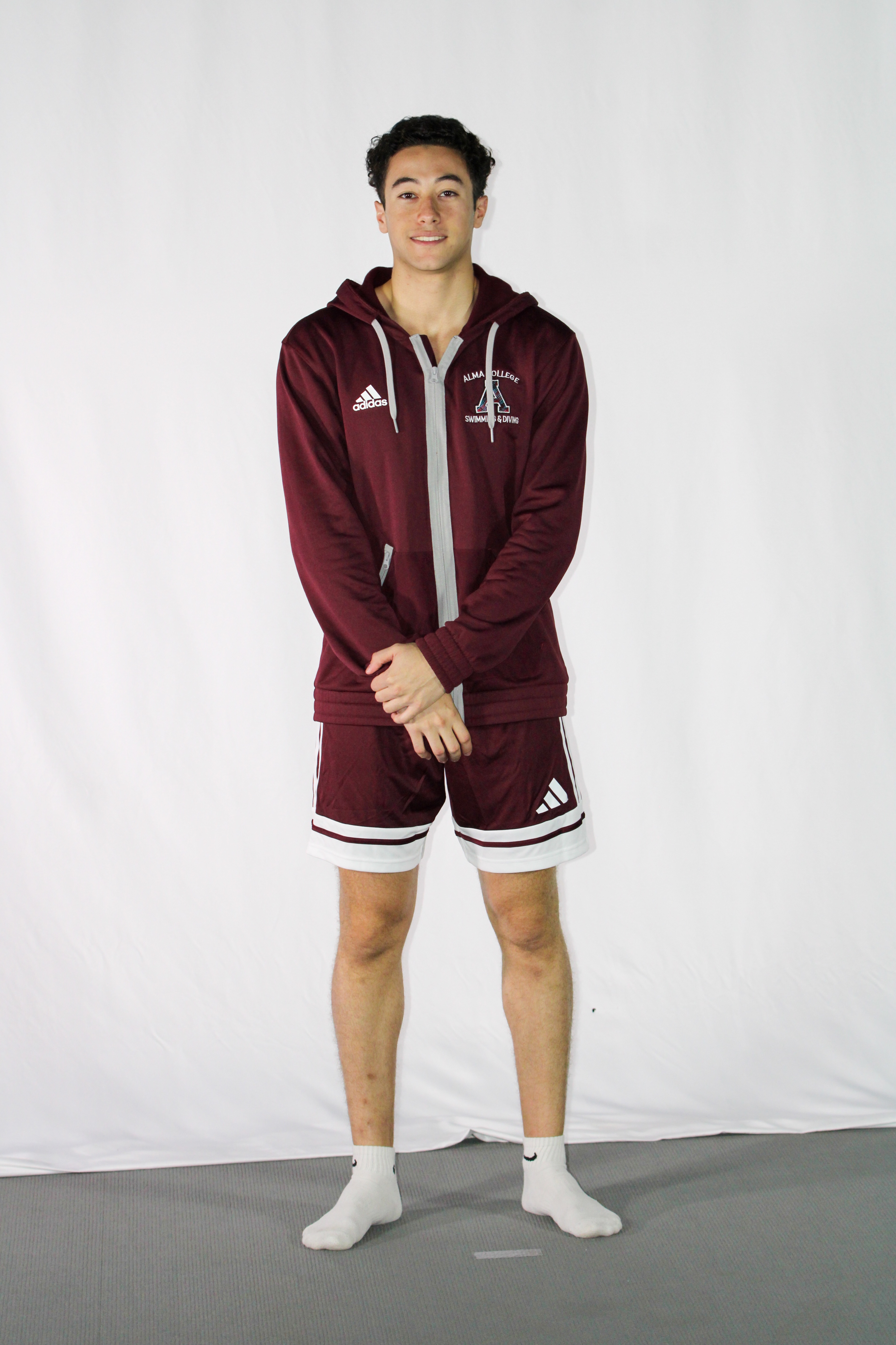Rayane in Alma swim team uniform